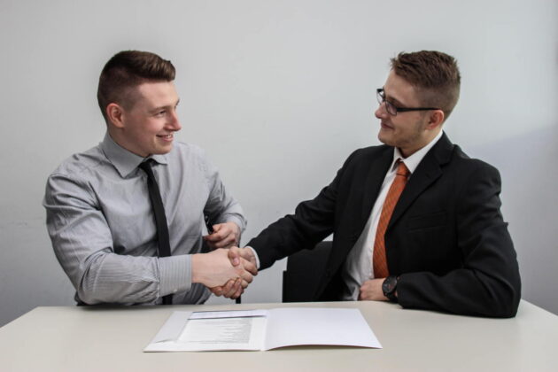 two men handshaking