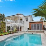 double story house with a pool