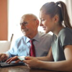 woman with credit card and laptop