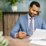 man looking at document