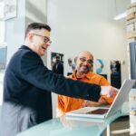 men looking at laptop