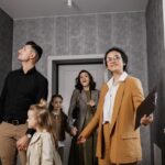 family looking at new home with realtor