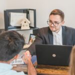 mortgage broker shaking hands with homebuyer