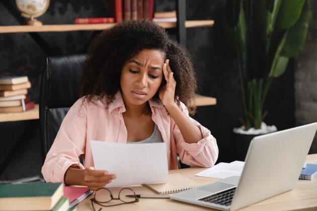 Woman reading mortgage documents