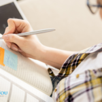 A woman writing in a notebook